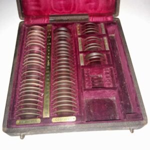 Early trial lens set 1874 in red velvet lined wooden case with biconvex biconcave lenses marked in inches of focal length, rare pre-diopter antique ophthalmic refraction instrument