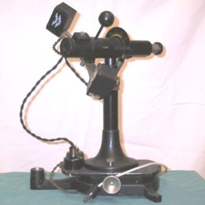 Antique Javal-Schiotz keratometer c.1950 with black finish and brass fittings on instrument stand, classic corneal curvature measurement device missing patient support stand