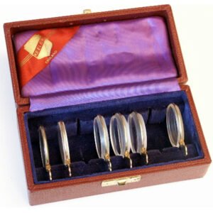 Antique iseikonic lens set for aniseikonia correction in original fitted wooden case with purple and orange silk lining, rare mid-20th century ophthalmic instrument