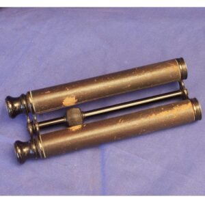 Antique long Keplerian binoculars in brass, showing elongated twin telescope barrels used before prism optics were invented