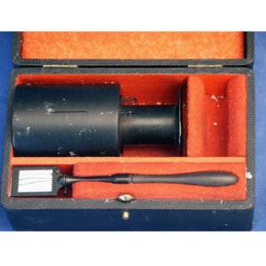 Antique Landolt ophthalmodynamometer by Roulet Paris 1885 with black chimney body and frosted glass slit, presented in original fitted orange velvet case, convergence amplitude measuring instrument