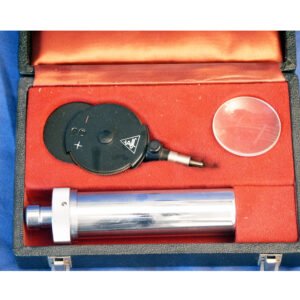 Early Heine electrical ophthalmoscope with dark lens disc head, polished aluminium battery handle, and condensing lens, presented in original fitted red velvet case