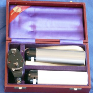 Antique Keeler electrical ophthalmoscope with two battery handles in original fitted case with purple velvet lining, mid-20th century British ophthalmic instrument