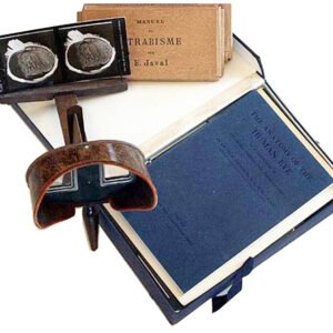 Antique Holmes stereoscope with cards, wooden handle and twin lenses, shown with original Victorian eye anatomy stereocard collection