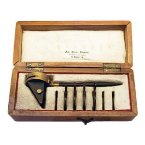 Antique Helmholtz ophthalmoscope by Rekoss of Königsberg in original fitted wooden case, three glass plates and seven correcting lenses