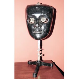 Rare ophthalmophantome circa 1900, German cast metal surgical eye training mask on adjustable stand, front and detail views