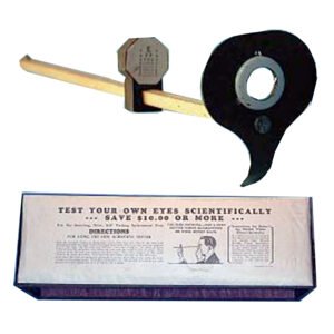 Antique mail order optometer "test your own eyes" device with paddle handle, peephole lens, and original printed instruction card